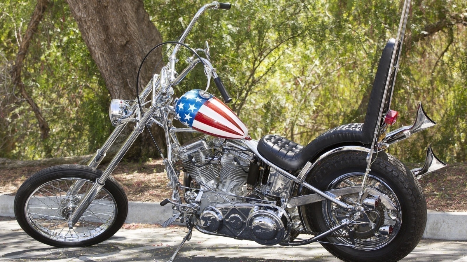 The Profiles In History auction house in Calabasas, Calif., is auctioning off the supposedly last authentic 'Captain America' chopper used in the film Easy Rider.Â The proceeds will go in part towards Michael Eisenberg, the current owner of the bike, as well as to the auction house and the American Humane Association